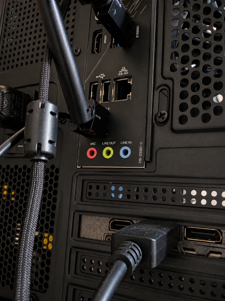 Rear I/O panel showing DisplayPort cable correctly connected directly to the dedicated graphics card port