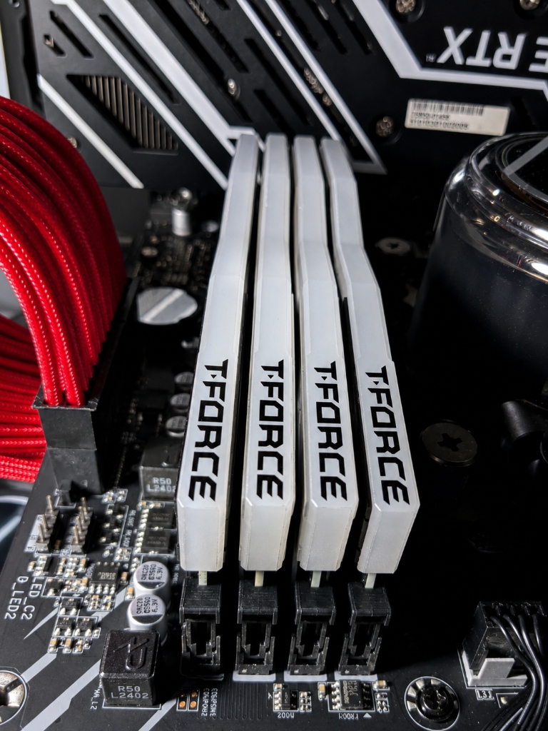 Proper RAM seating in motherboard DIMM slots showing all sticks fully engaged